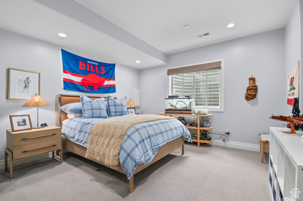 Carpeted bedroom with recessed lighting and baseboards