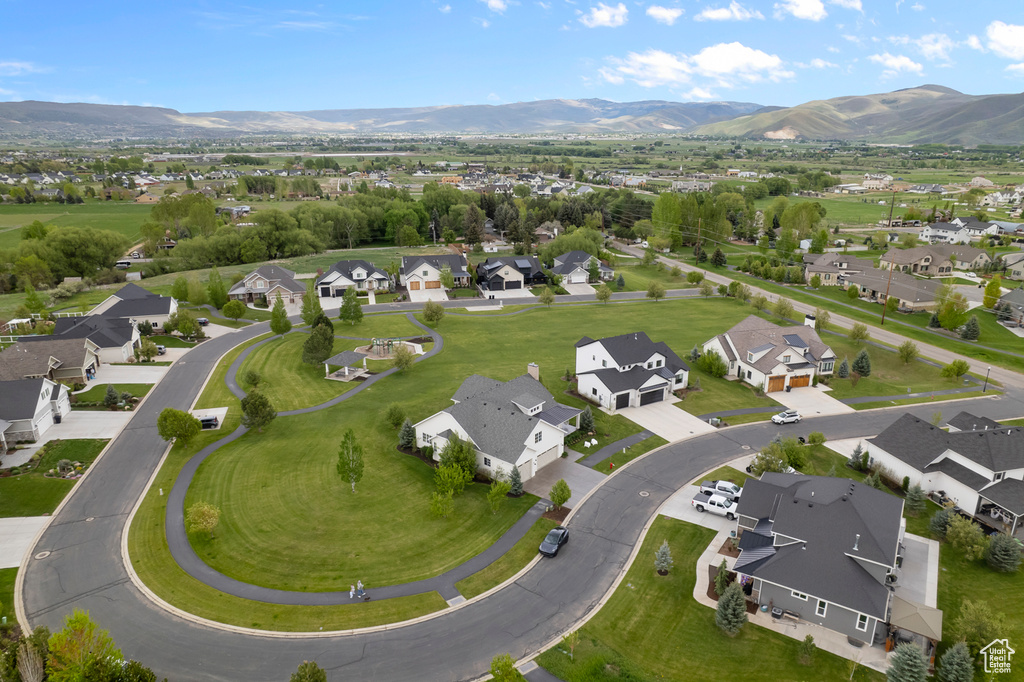 Aerial view of residential area featuring a mountain backdrop