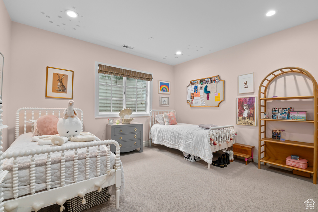 Carpeted bedroom with recessed lighting