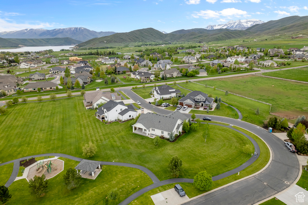 Aerial perspective of suburban area featuring a water and mountain view