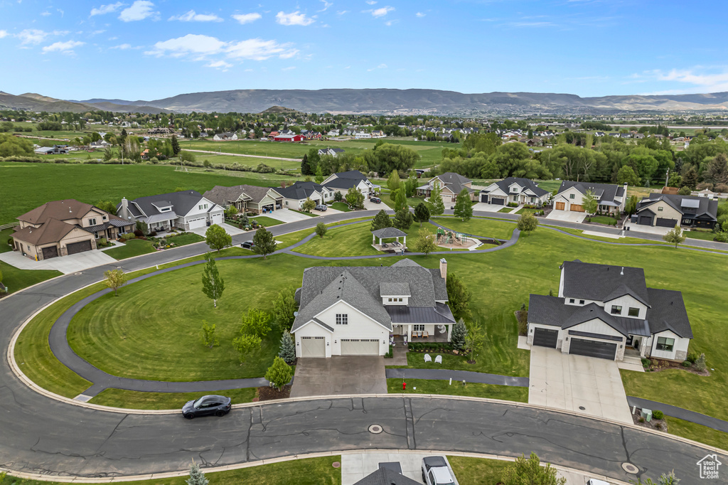 Aerial view of residential area featuring mountains