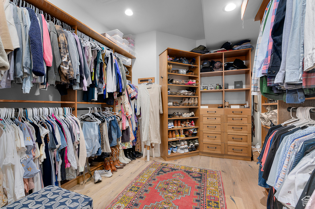 Walk in closet featuring wood finished floors