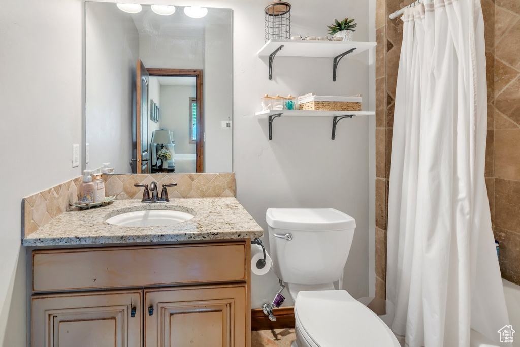 Bathroom featuring toilet and vanity