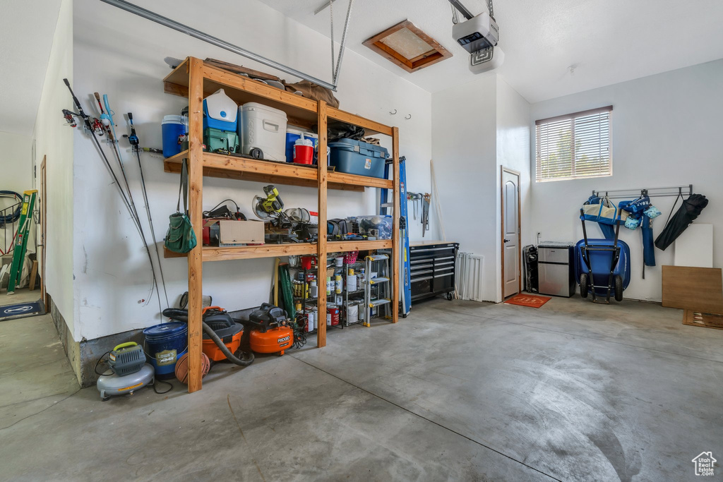 Garage featuring a garage door opener