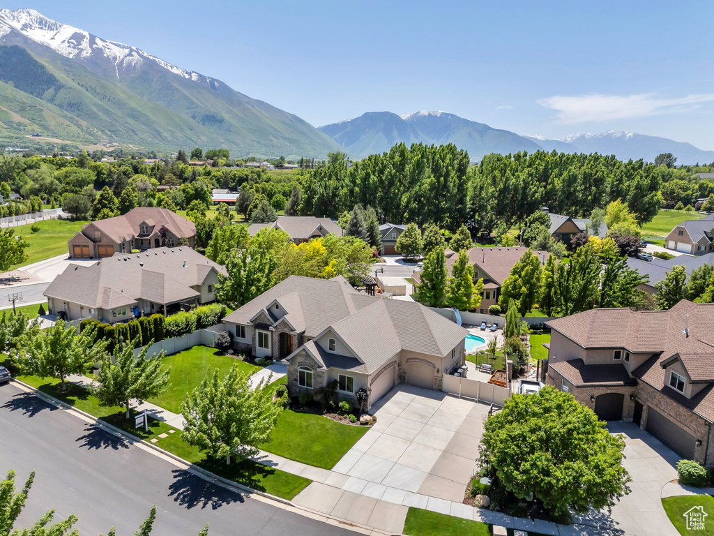 Aerial perspective of suburban area with a mountainous background