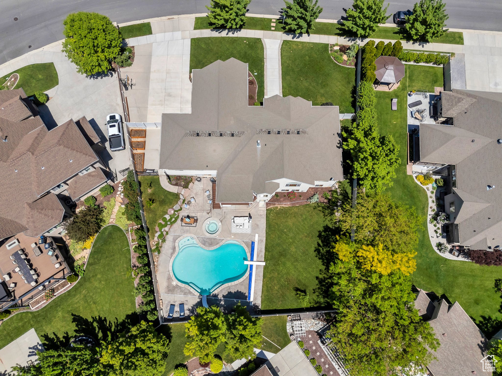 Aerial perspective of suburban area with a pool area
