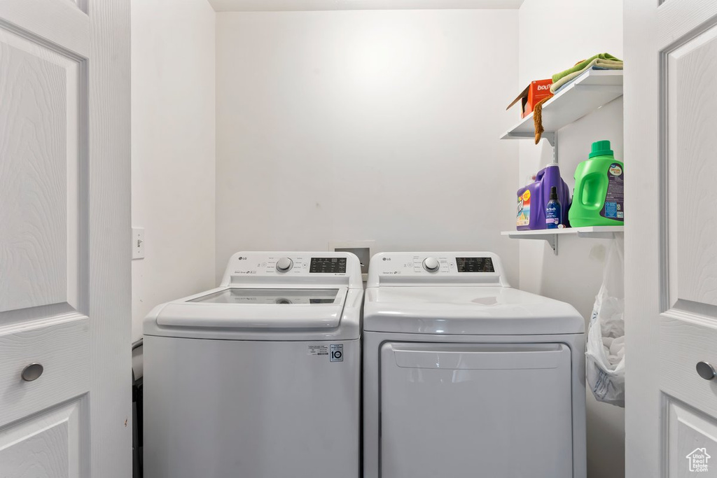 Laundry area featuring independent washer and dryer