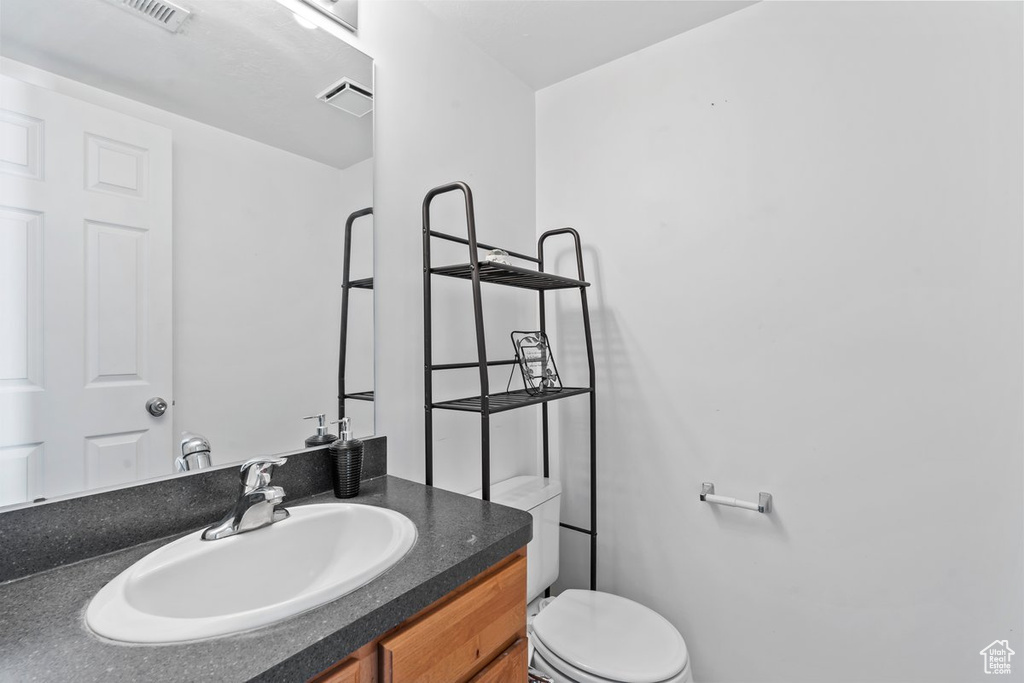 Bathroom featuring toilet and vanity