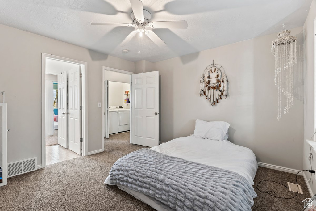 Bedroom featuring carpet, baseboards, independent washer and dryer, and ceiling fan