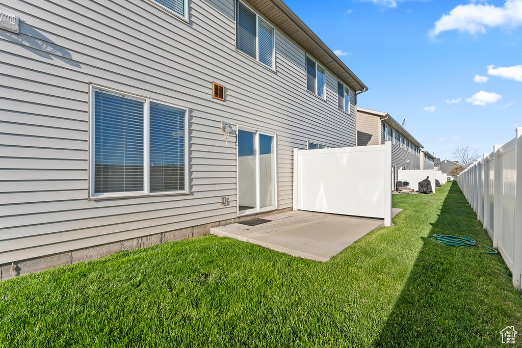 Back of property featuring a patio