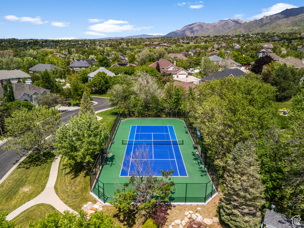 Aerial view of residential area featuring a mountainous background