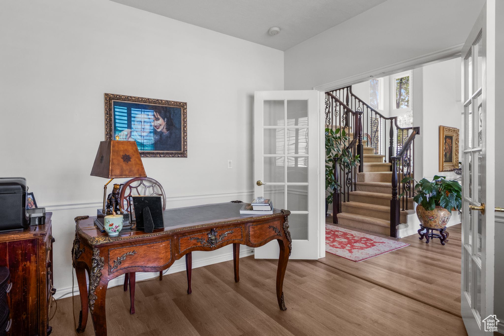 Office featuring wood finished floors and french doors