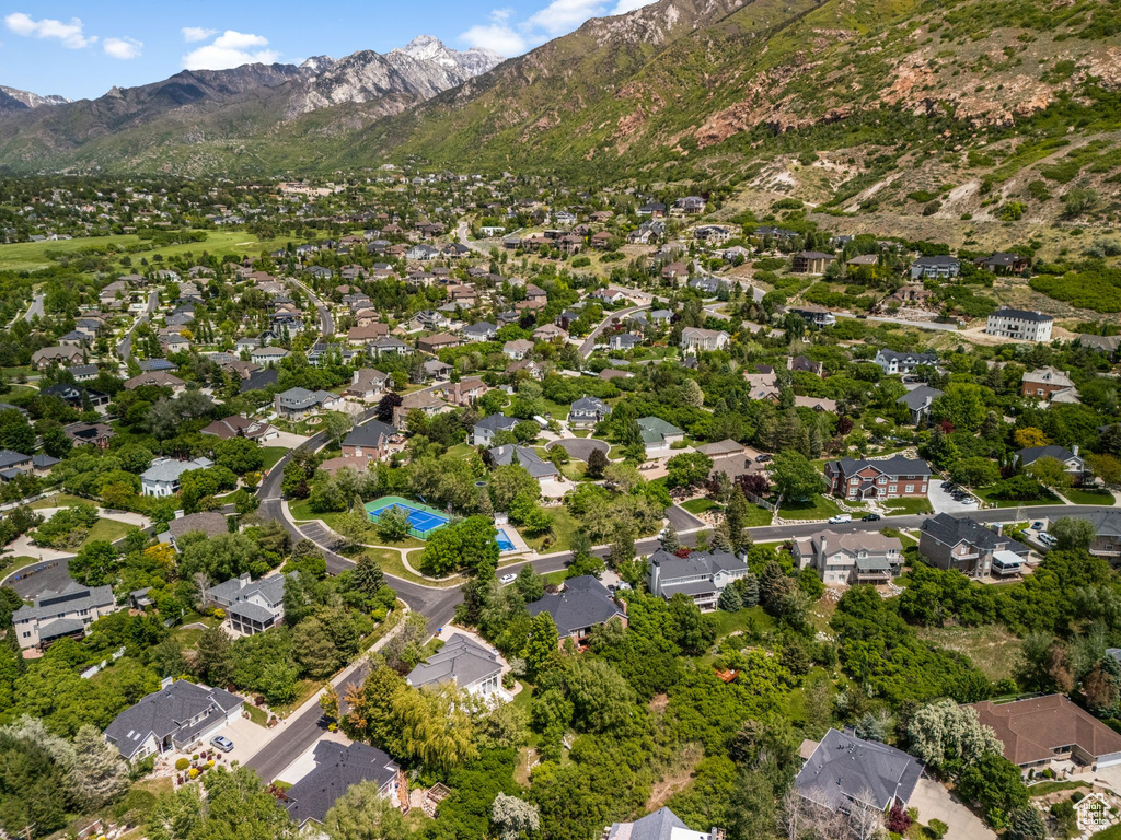 Aerial overview of property\\\'s location featuring mountains and nearby suburban area