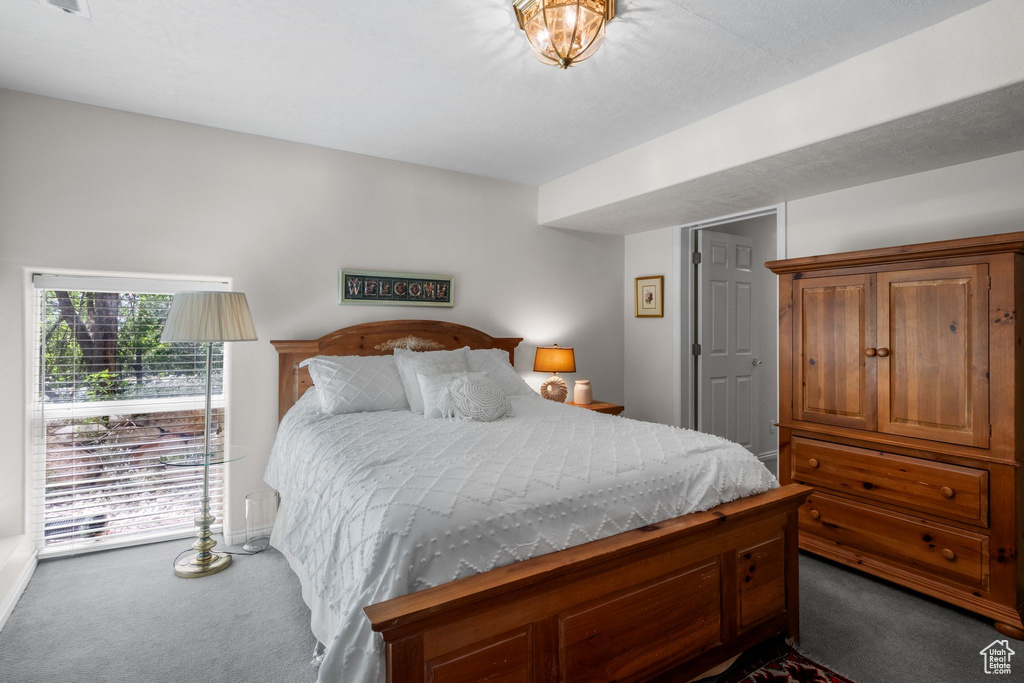 Carpeted bedroom with baseboards