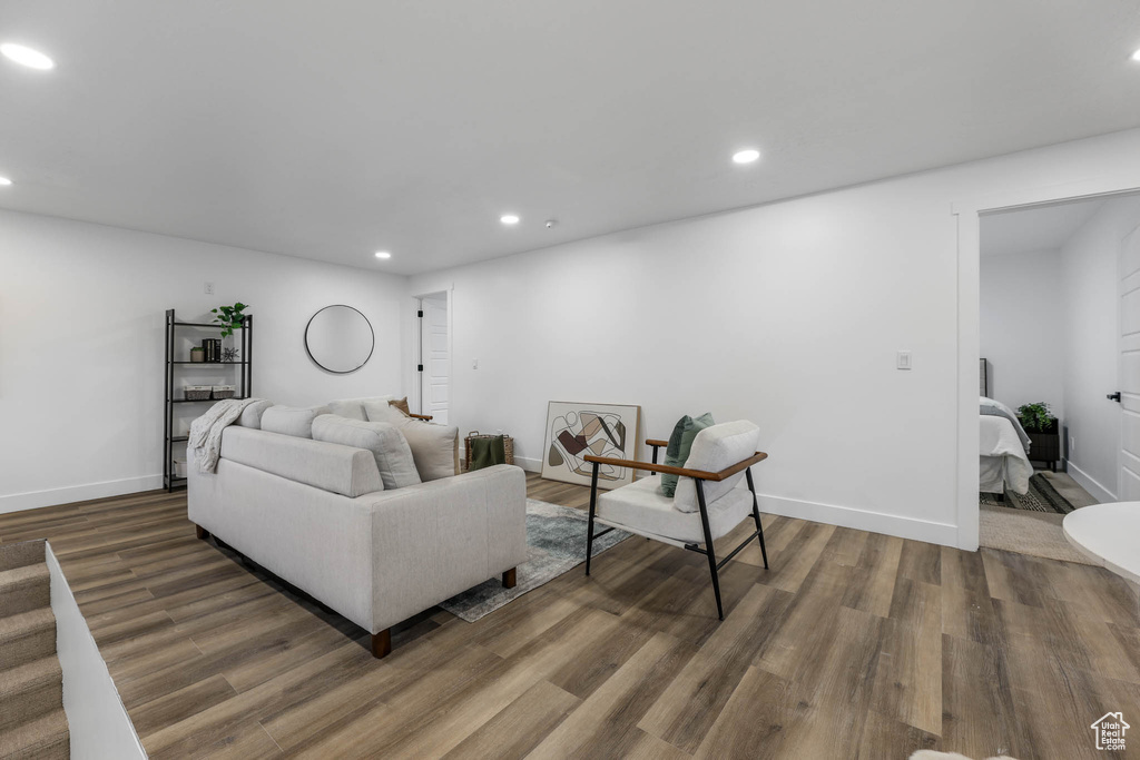 Living room featuring recessed lighting, wood finished floors, and baseboards