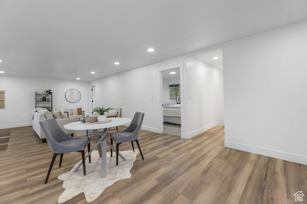 Dining space with recessed lighting, light wood-type flooring, and baseboards