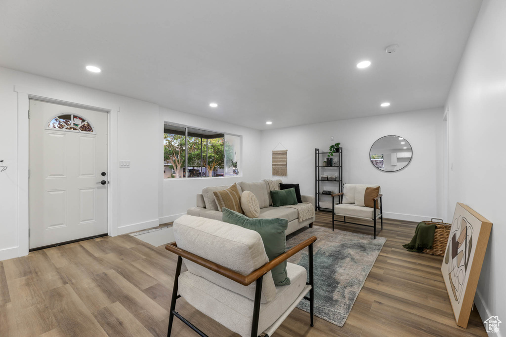 Living room featuring recessed lighting, wood finished floors, and baseboards