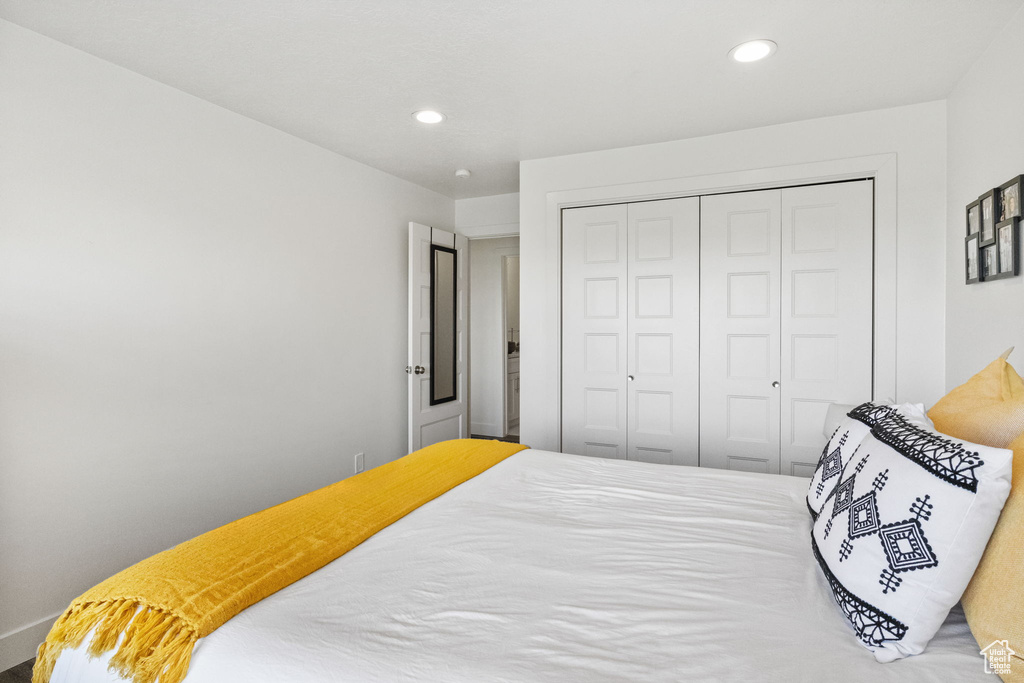 Bedroom featuring recessed lighting and a closet