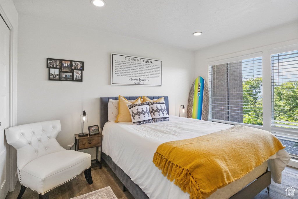 Bedroom with wood finished floors and recessed lighting