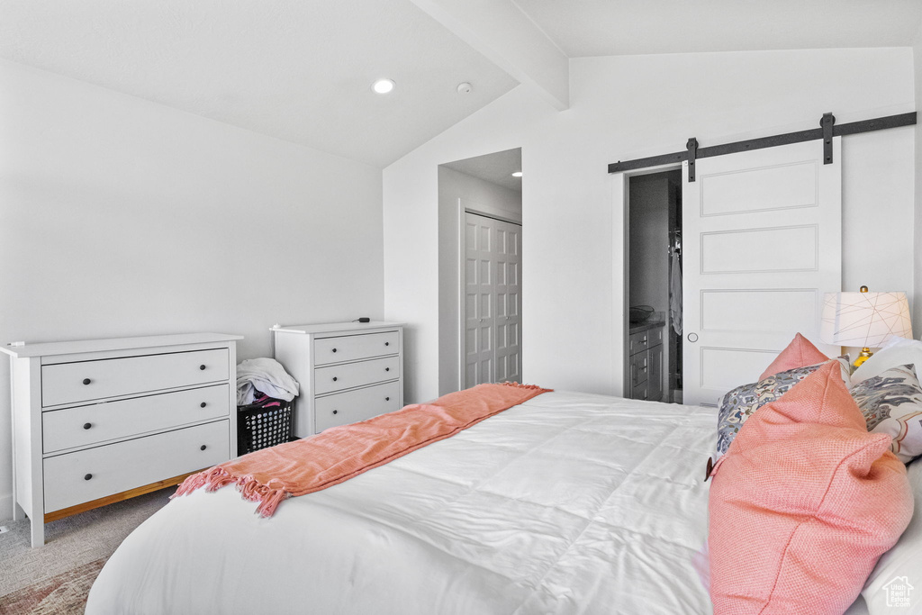 Bedroom with a barn door, carpet floors, and recessed lighting