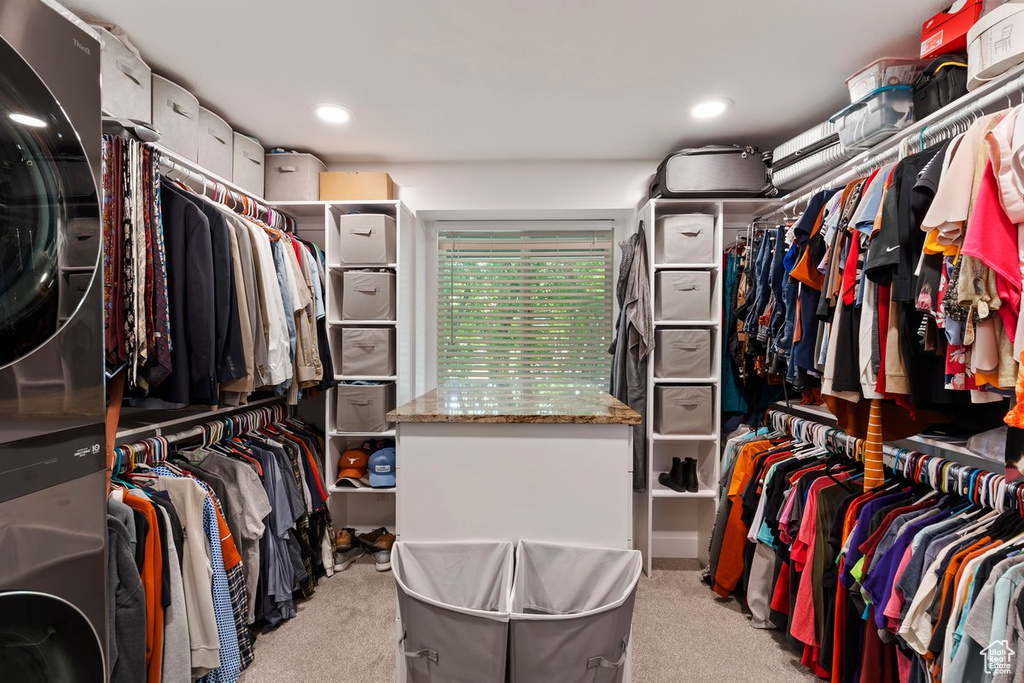 Spacious closet featuring carpet flooring