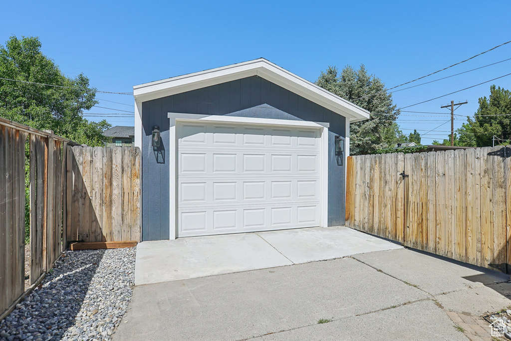 Detached garage featuring driveway