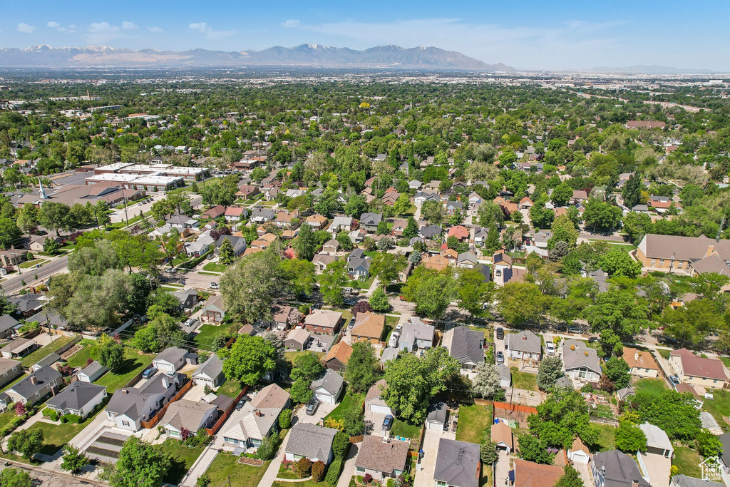 Aerial view of property\\\'s location featuring a mountain backdrop and nearby suburban area