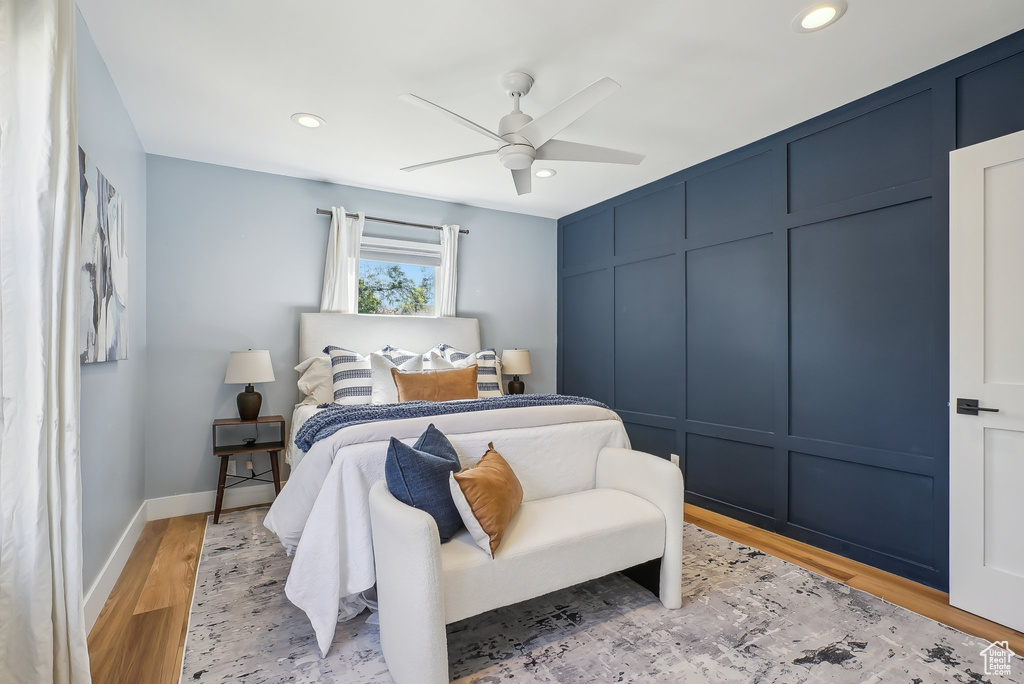 Bedroom with recessed lighting, light wood-style floors, ceiling fan, and baseboards