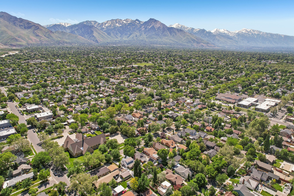 Aerial view of residential area featuring mountains
