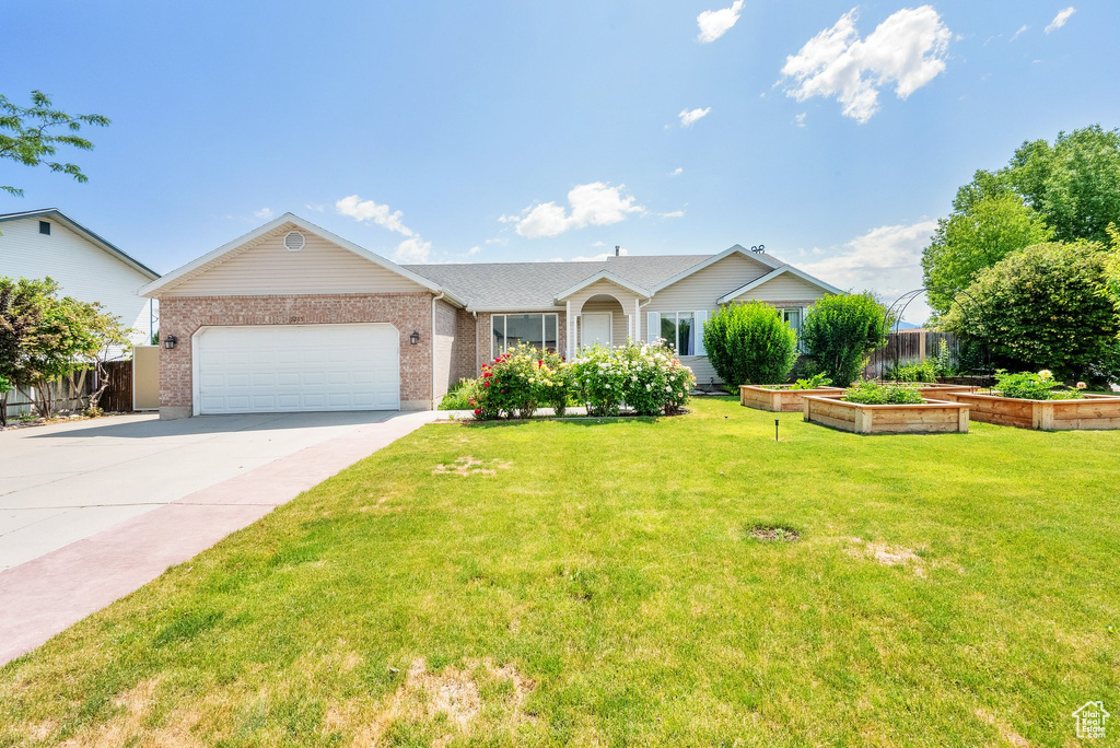 Ranch-style home with brick siding, concrete driveway, and a garage