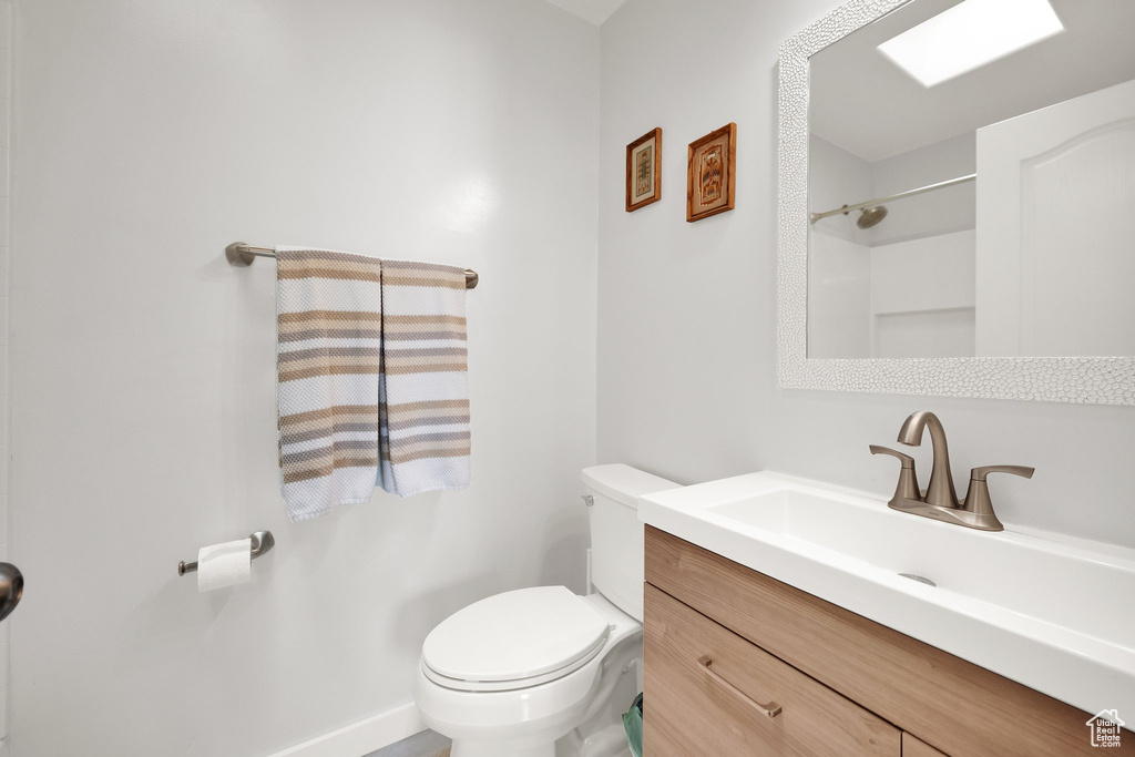 Full bath featuring toilet and vanity