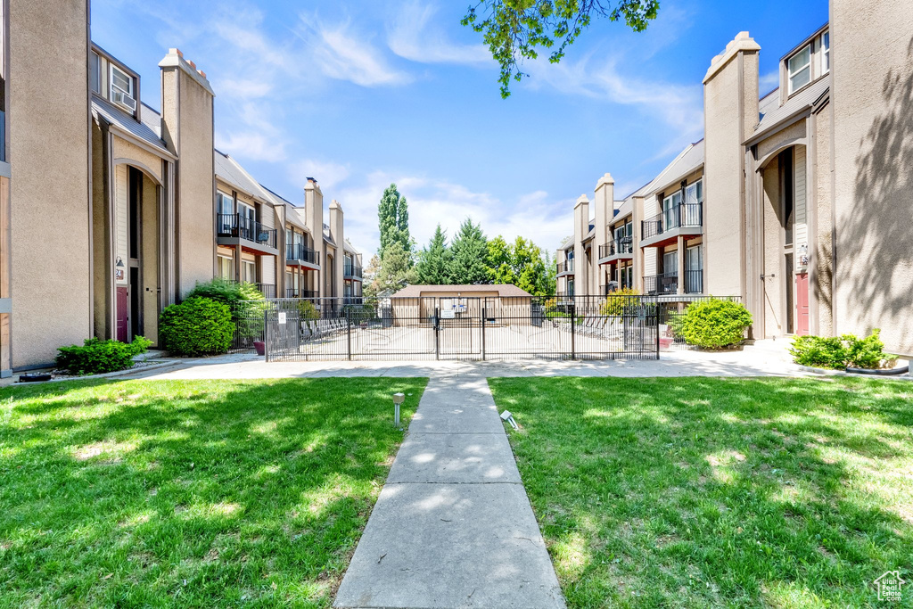 View of community featuring a residential view and a gate