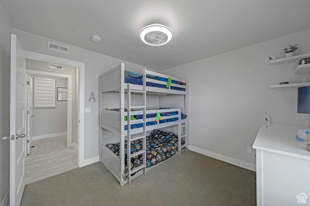Bedroom featuring baseboards and carpet floors