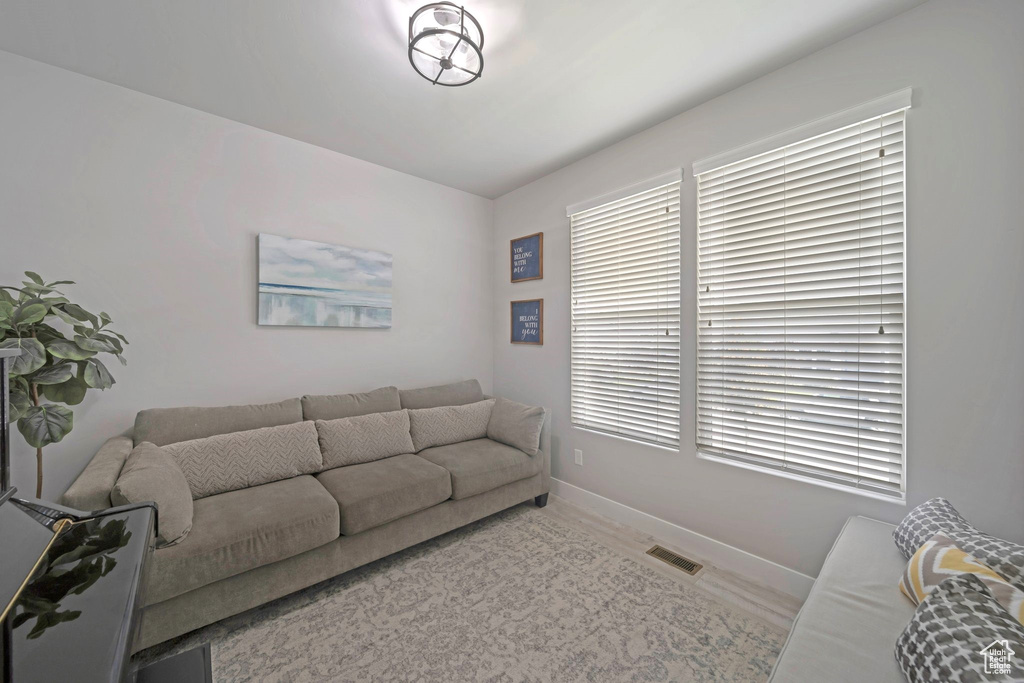 Living room with baseboards and plenty of natural light