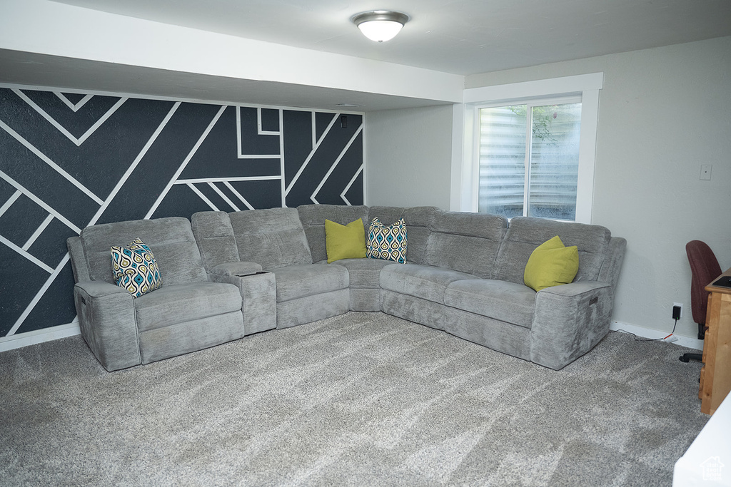 Living room featuring carpet flooring and baseboards