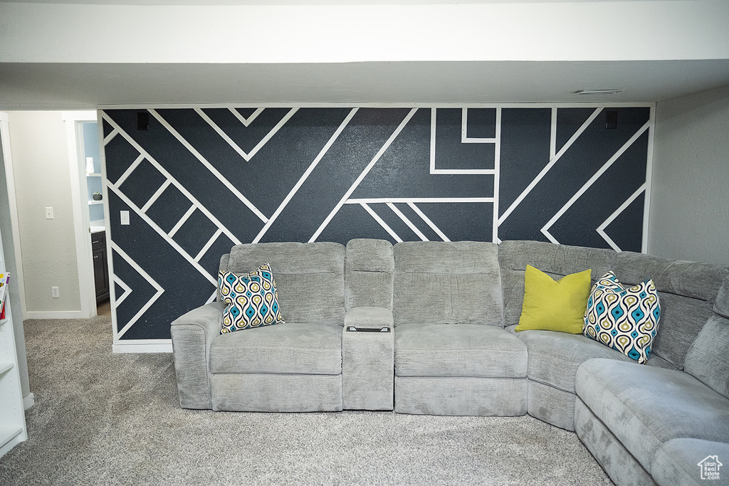 Living room featuring carpet and baseboards