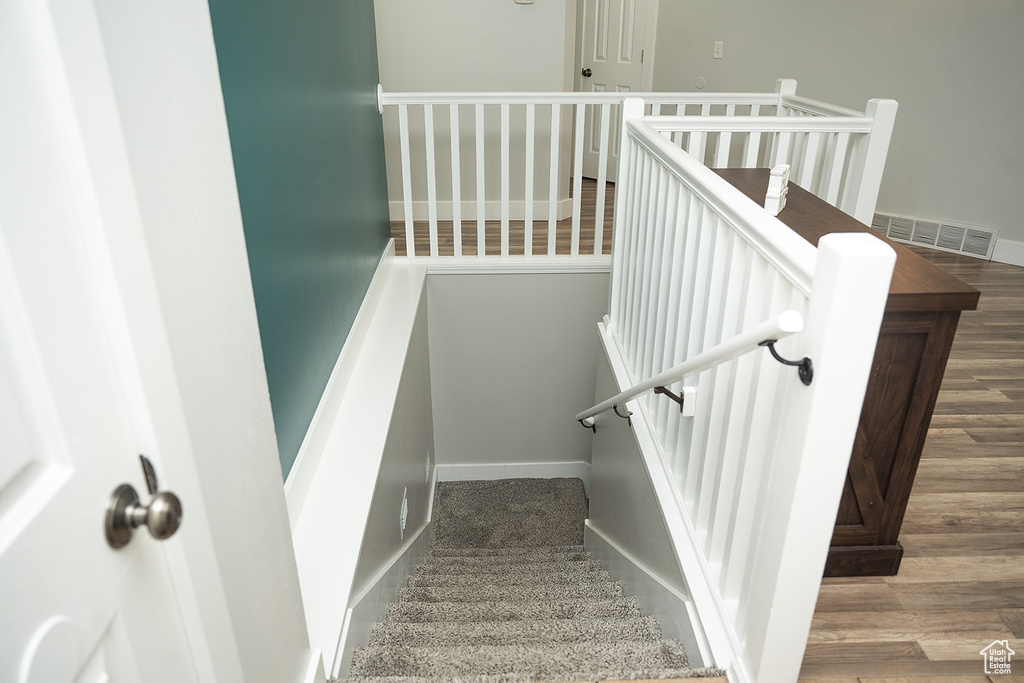 Staircase with wood finished floors