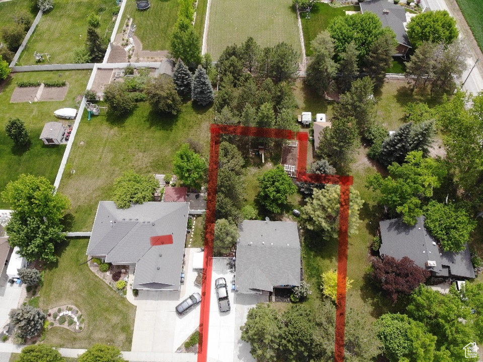Aerial view of property and surrounding area with property boundaries highlighted