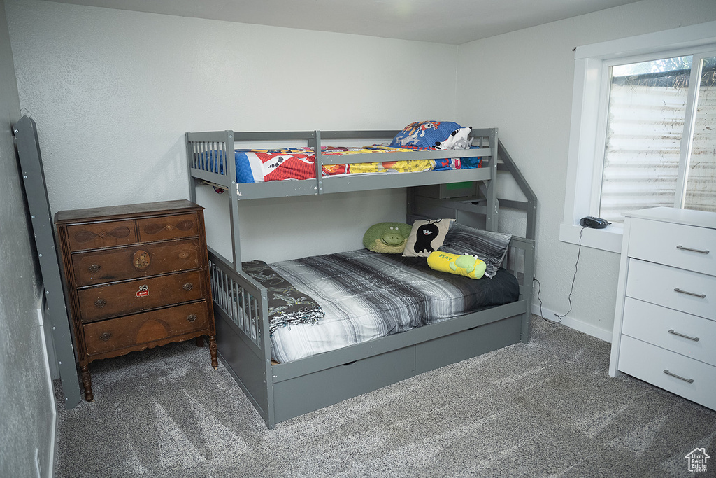 Bedroom with carpet and baseboards