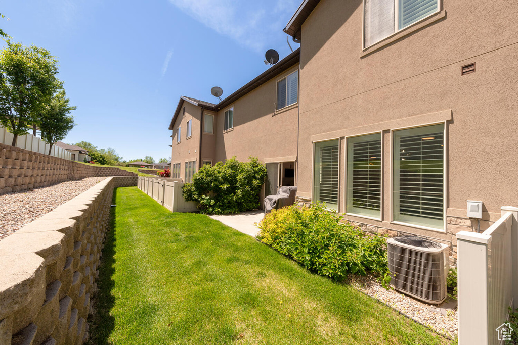 View of yard featuring central AC unit