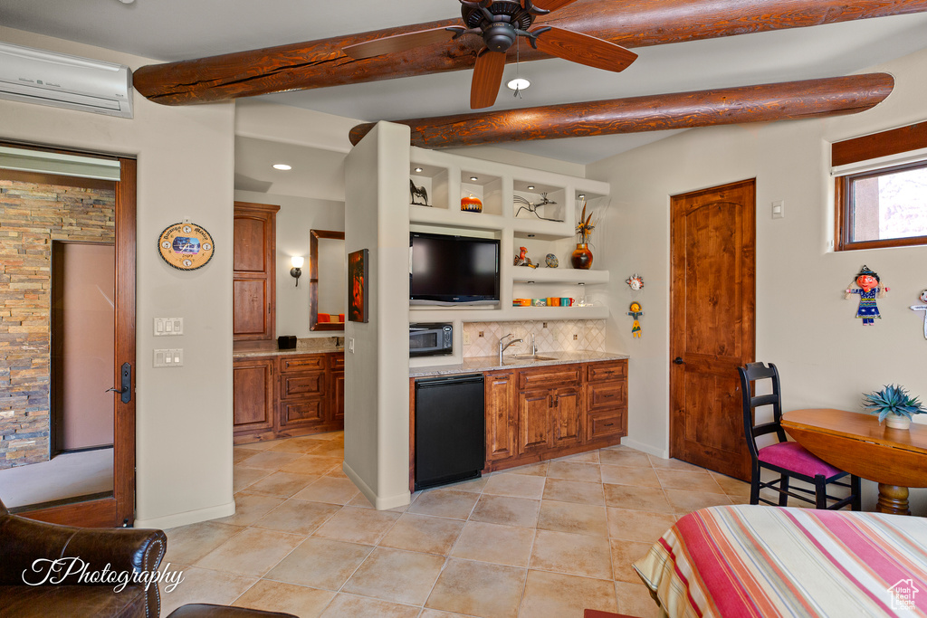 Kitchen featuring a sink, a ceiling fan, brown cabinets, beamed ceiling, and backsplash