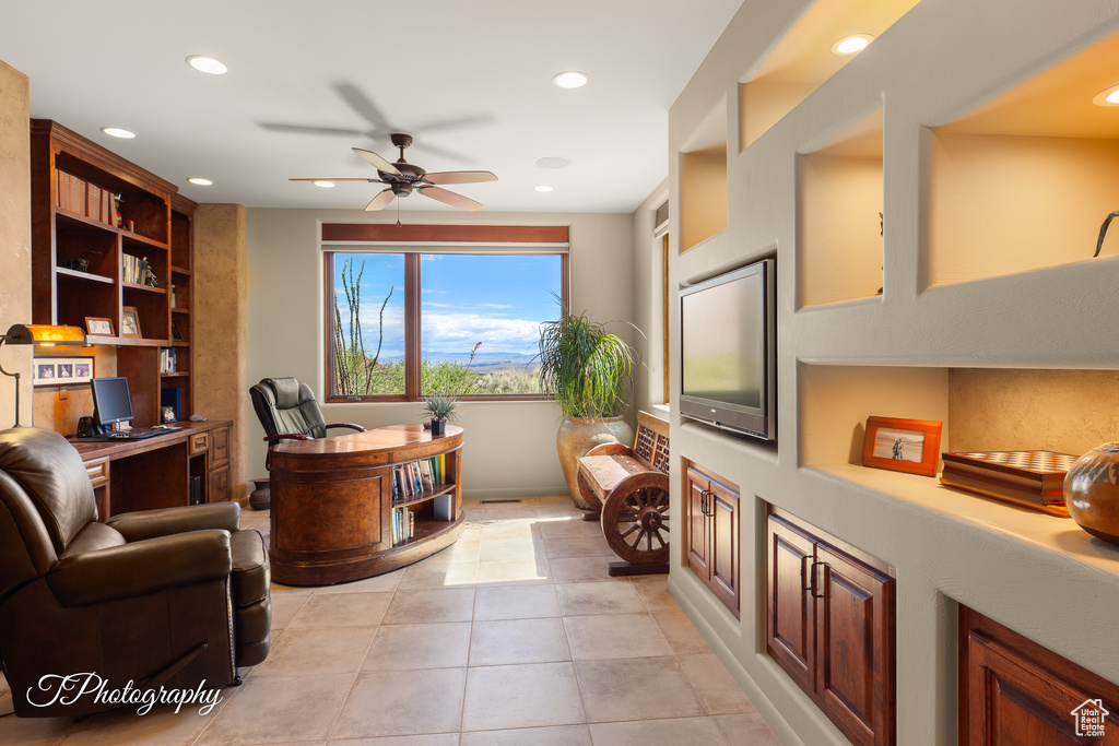 Office area with a ceiling fan, recessed lighting, built in features, light tile patterned flooring, and built in desk