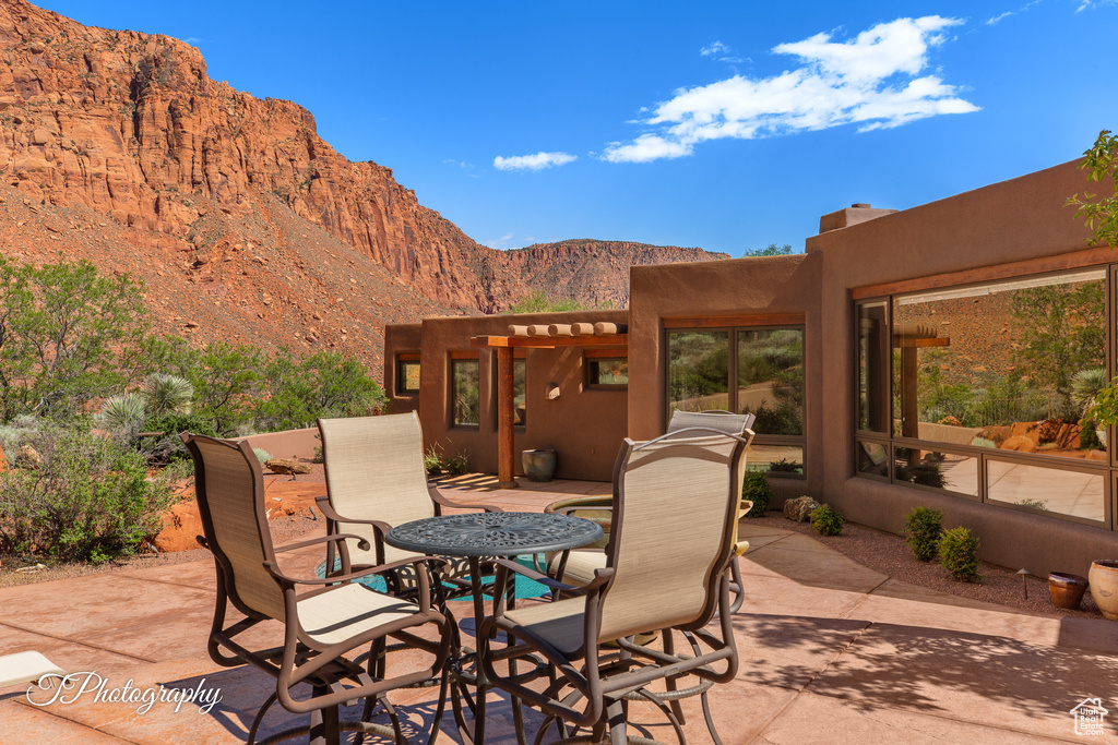 View of patio / terrace with a mountain view and outdoor dining space