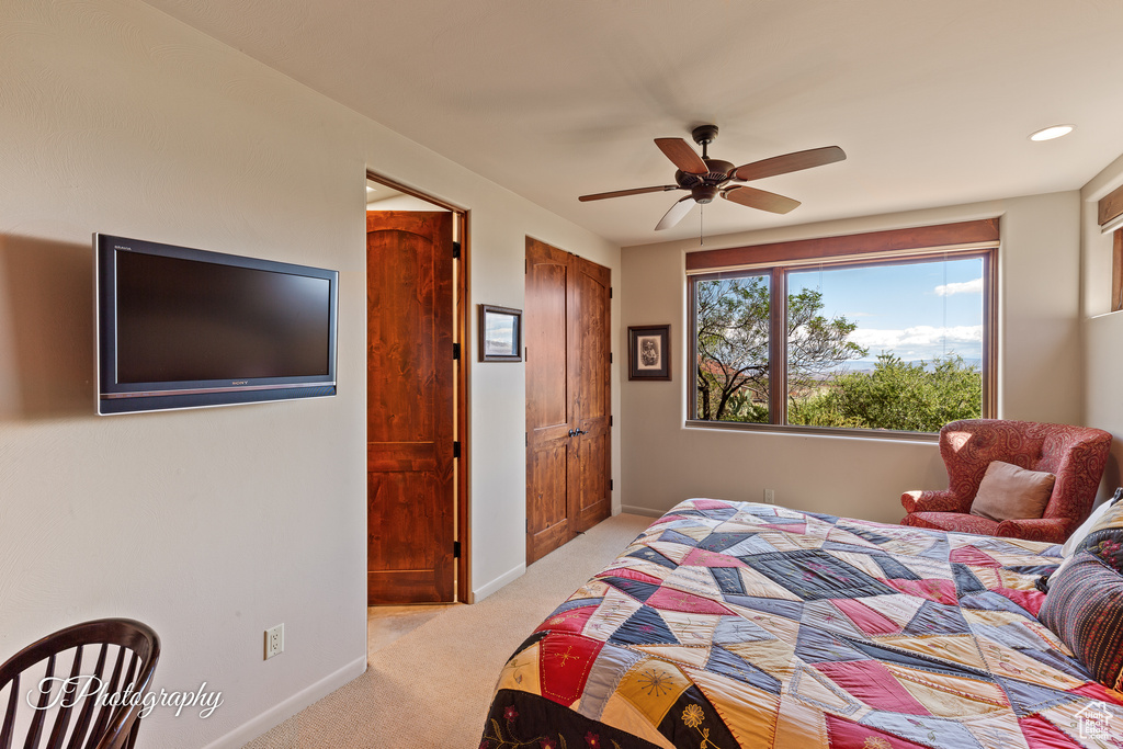 Bedroom with light colored carpet, baseboards, a ceiling fan, and recessed lighting