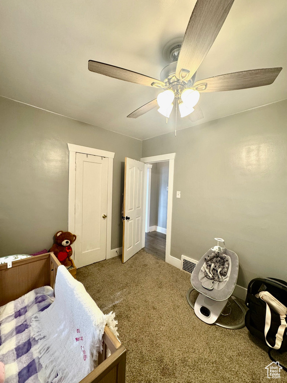 Bedroom featuring carpet, ceiling fan, and baseboards