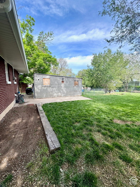 View of yard with a patio area