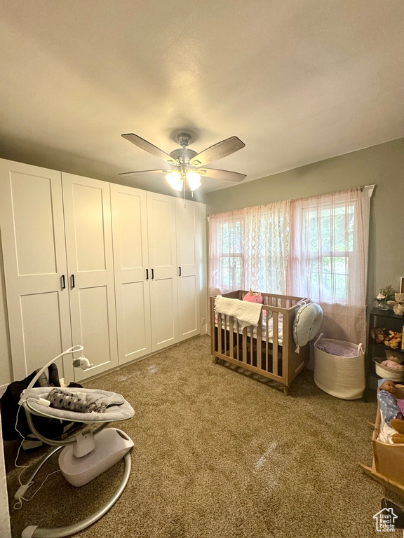 Bedroom with carpet and ceiling fan