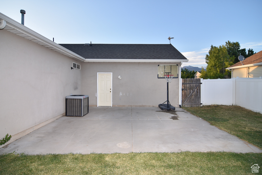 View of patio / terrace featuring central air condition unit and a gate