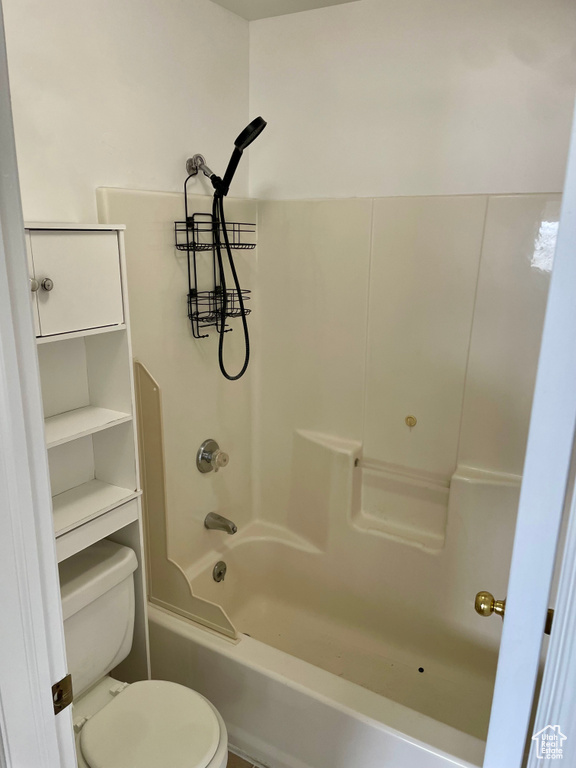 Bathroom with toilet and shower / tub combination