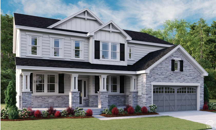 Craftsman-style home with covered porch, board and batten siding, stone siding, a front lawn, and concrete driveway